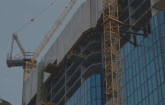 Photo of an exterior of a high-rise building under construction.
