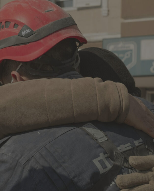 First responder hugging someone in need