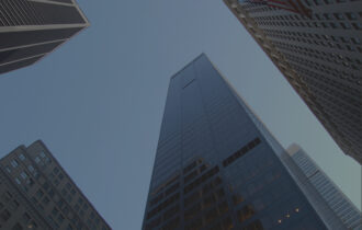 City skyline facing upwards toward big buildings