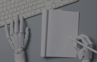 A keyboard and notepad in frame on a gray table with robot hands writing and typing