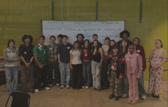 Group of teens in front of a white HighView poster
